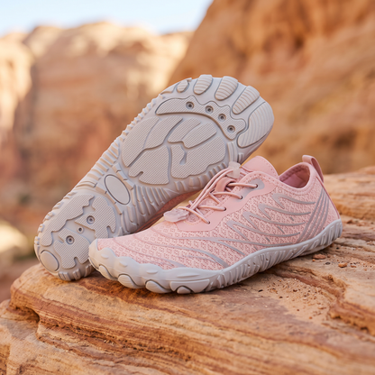 Soft Pink water trekking shoes on warm sandstone rock